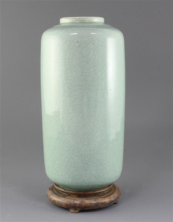 A Chinese pale green crackle glazed cylindrical vase, probably 19th century, 31.5cm, wood stand